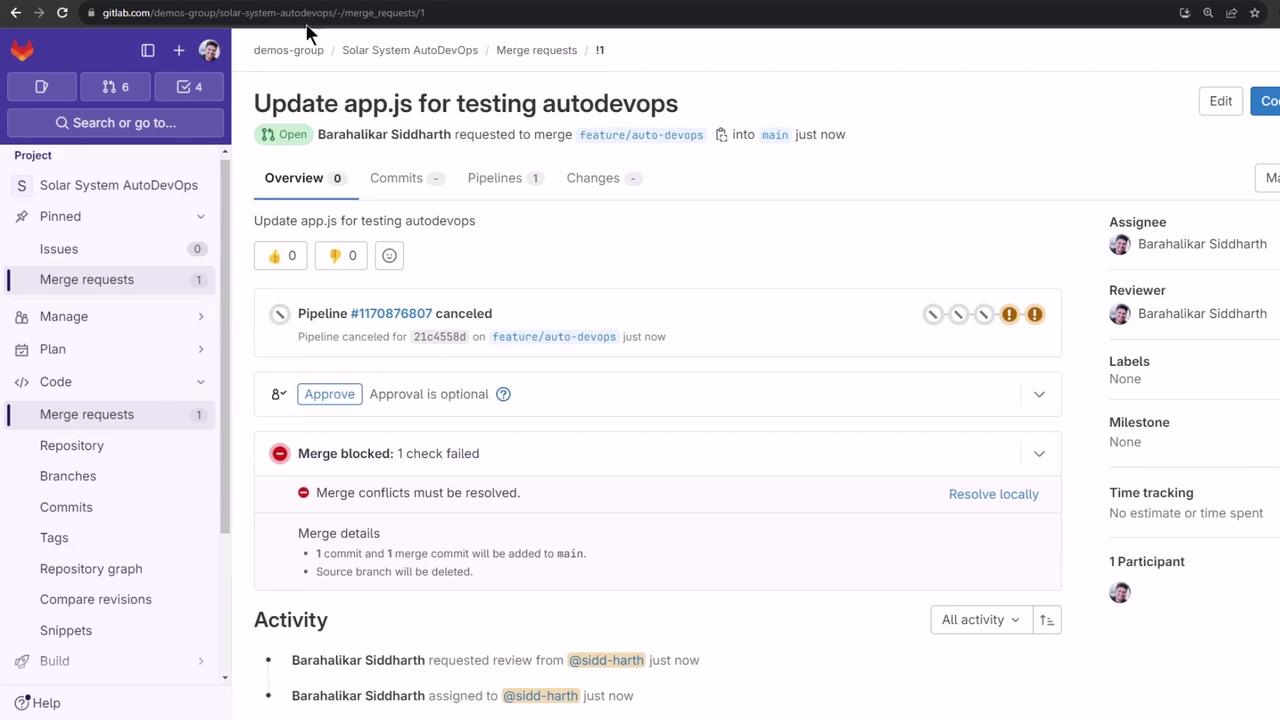 The image shows a GitLab interface with a merge request titled "Update app.js for testing autodevops." The request is open, but the pipeline was canceled, and there is a merge conflict that needs resolution.